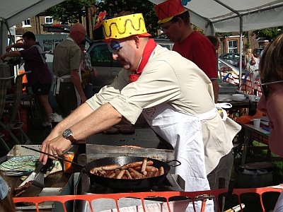 Cooking sausages in the Scouts tent